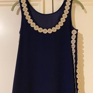 Blue sheath dress with gold and bow details